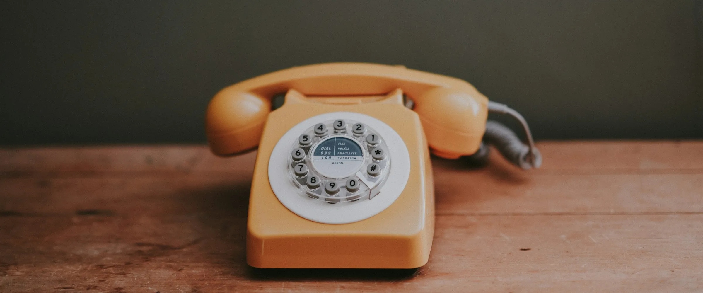 Old school: https://unsplash.com/photos/brown-rotary-dial-telephone-in-gray-painted-room-goholCAVTRs